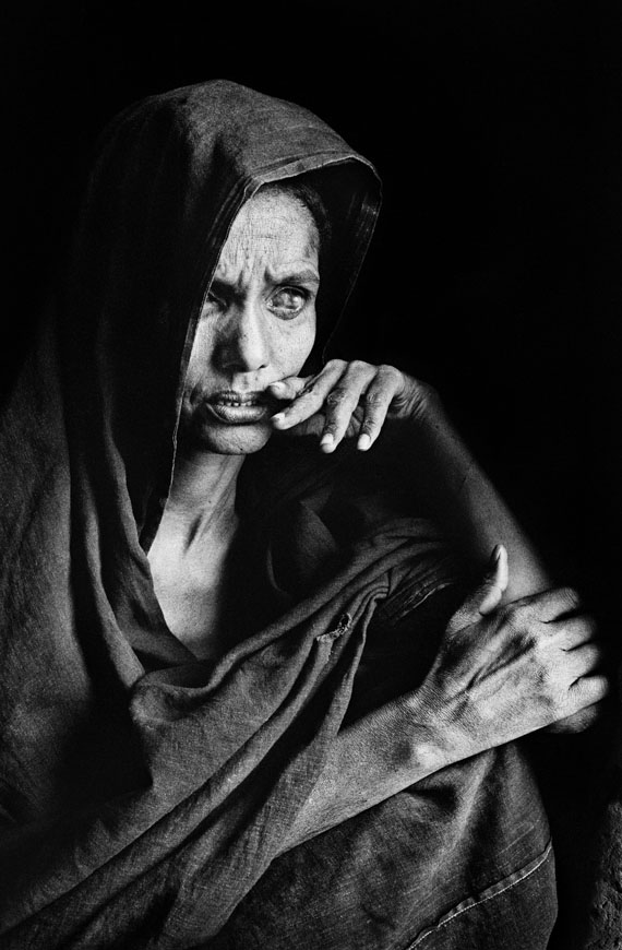 Sebastião Salgado - Goundam region. This woman blinded by sandstorms and chronic eye infections, has reached a refugee camp. Mali, 1985