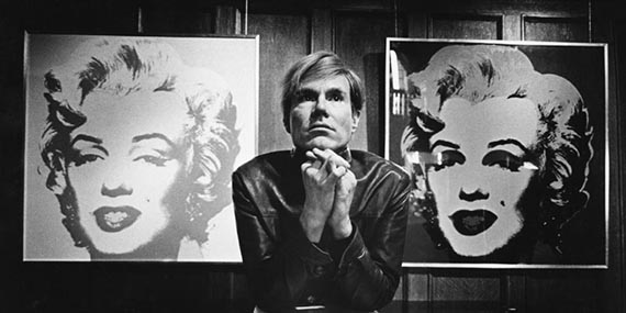 Illustration  for:  Andy Warhol in front of two paintings from the Marilyn series, photo: Donald Getsug. © The Andy Warhol Foundation for the Visual Arts 
